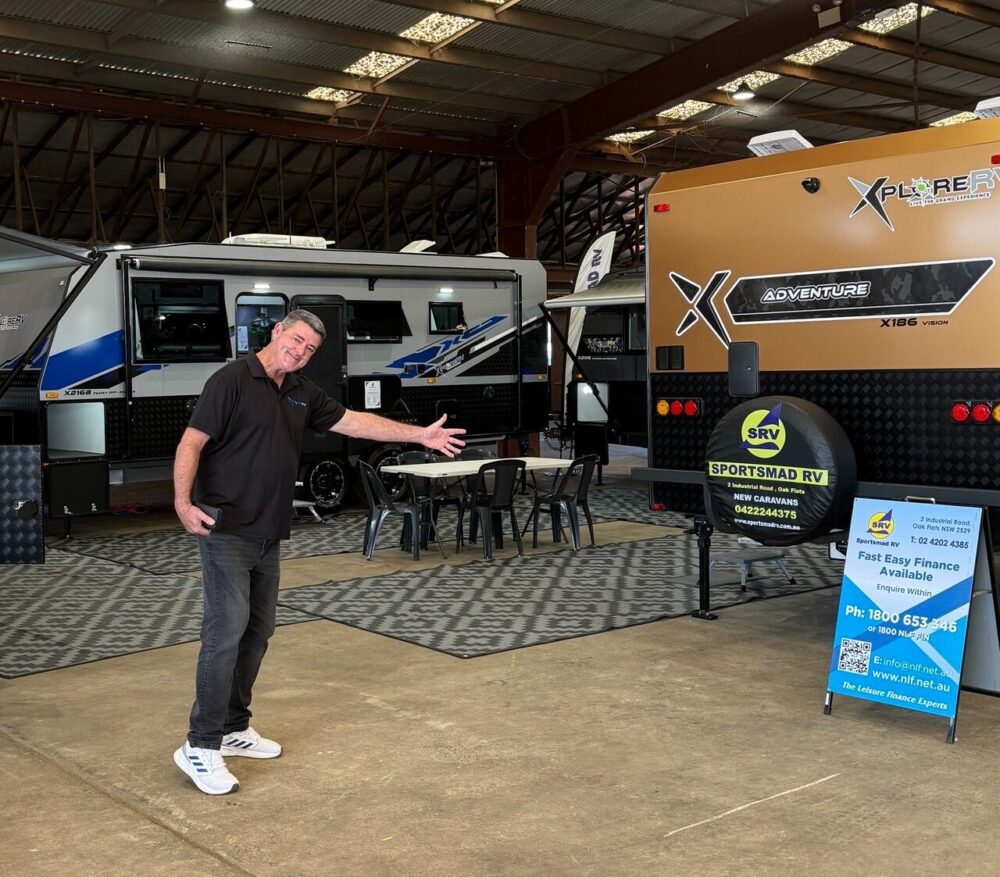 Friendly James welcoming clients to discuss caravan finance.